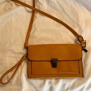 Small leather clutch purse with long arm strap. Perfect condition. NWOT